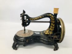 A VINTAGE HUMP BACK SEWING MACHINE COMPLETE WITH BOBBIN.