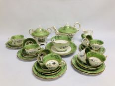 A VICTORIAN PART TEA SERVICE, DECORATED WITH BIRDS AND AN APPLE GREEN BORDER.