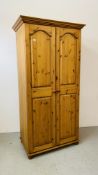 A GOOD QUALITY SOLID HONEY PINE DOUBLE WARDROBE W 96CM, D 56CM, H 188CM.