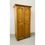 A GOOD QUALITY SOLID HONEY PINE DOUBLE WARDROBE W 96CM, D 56CM, H 188CM.