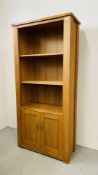 A MODERN SOLID OAK NEXT SHELVED UNIT WITH TWO DOOR CABINET BASE 87CM X 37CM X 191CM.
