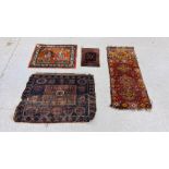 A PERSIAN RUG WOVEN WITH PAIR OF EXOTIC BIRDS BY A TWO HANDLED VASE AND FLOWERS 69CM X 53CM AND A