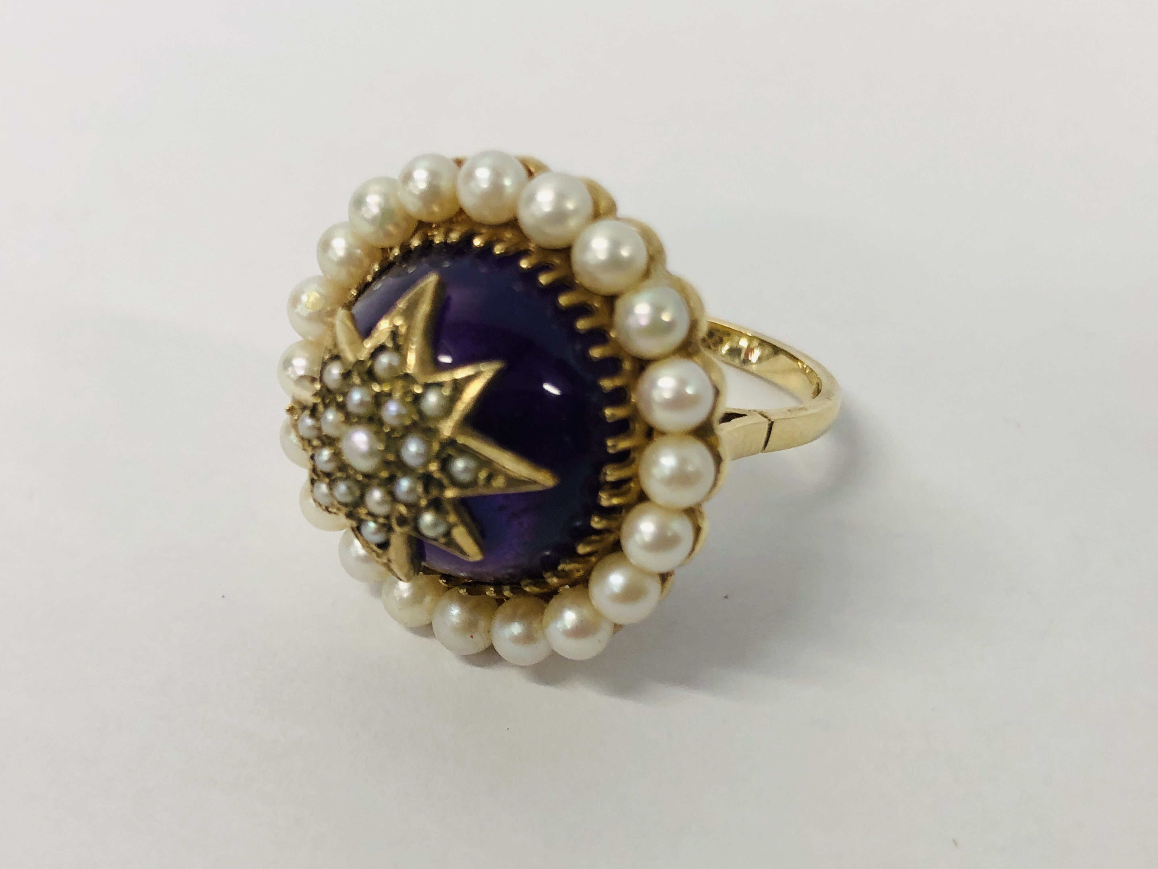 A VINTAGE VICTORIAN DESIGN 9CT. GOLD AMETHYST AND SEED PEARL RING OF RAISED FORM. - Image 7 of 10