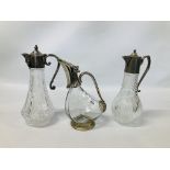 THREE SPIRIT DECANTERS - ONE IN THE FORM OF A DUCK, ONE WITH MASK LEAD SPOUT.