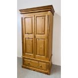 A GOOD QUALITY SOLID PINE TWO DOOR WARDROBE ON SINGLE DRAWER BASE W 102CM X D 60CM X H 194CM.