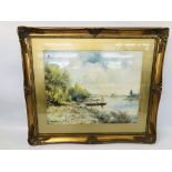 A FRAMED AND MOUNTED WATERCOLOUR OF A SHEPHERDESS MOVING HER SHEEP OVER THE LAKE BEARING SIGNATURE