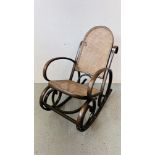 A BENTWOOD ROCKING CHAIR WITH RATTAN SEAT AND BACK