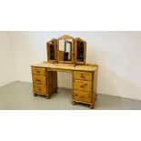 A GOOD QUALITY HONEY PINE SIX DRAWER DRESSING TABLE WITH TRIPLE DRESSING MIRROR WIDTH 143CM.