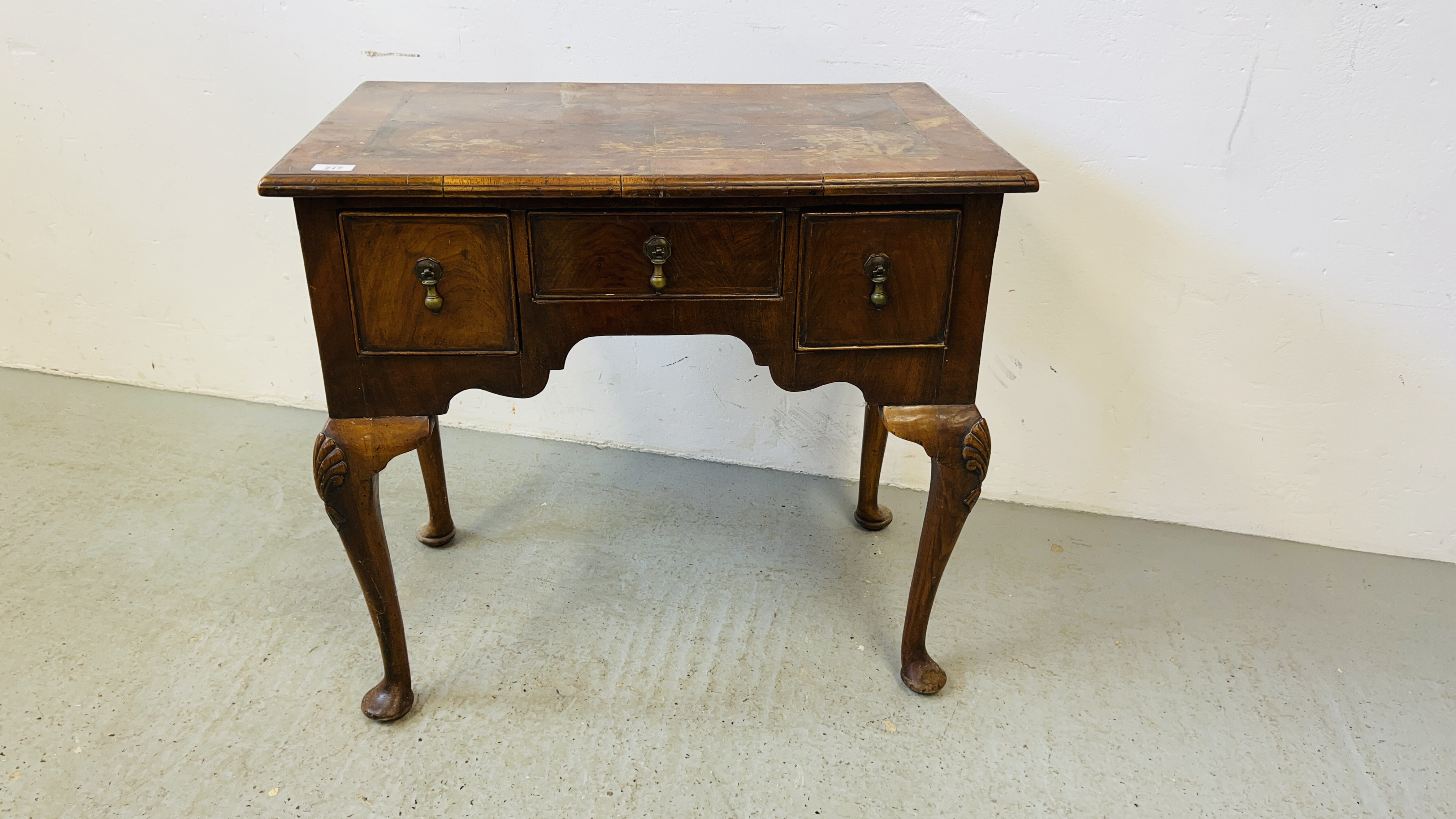 A WALNUT THREE DRAWER LOWBOY ON CABRIOLE LEGS, C18th AND LATTER, 77CM.