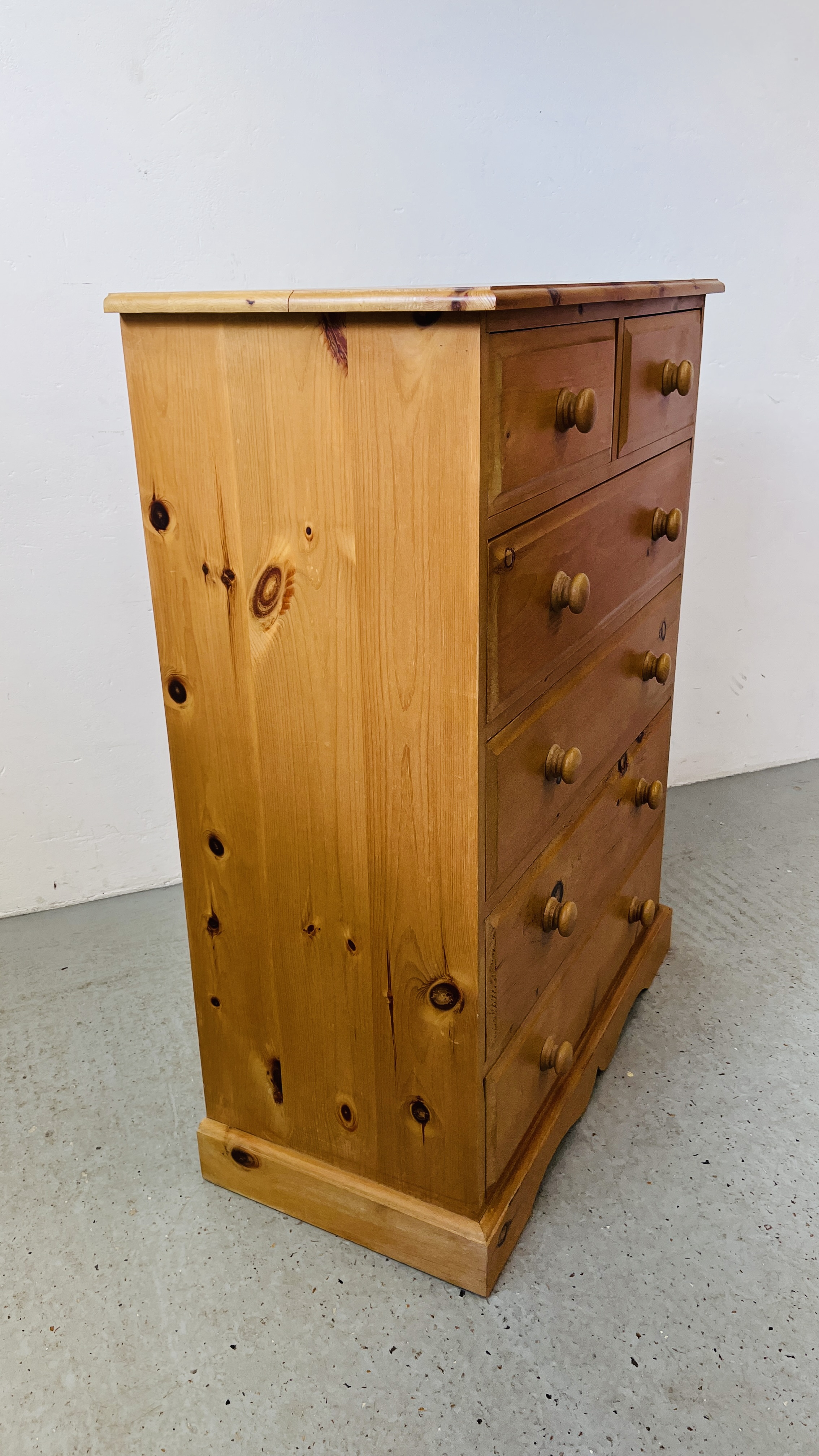 A SOLID PINE TWO OVER THREE CHEST OF DRAWERS W 85CM, D 43CM, H 117CM. - Image 7 of 8