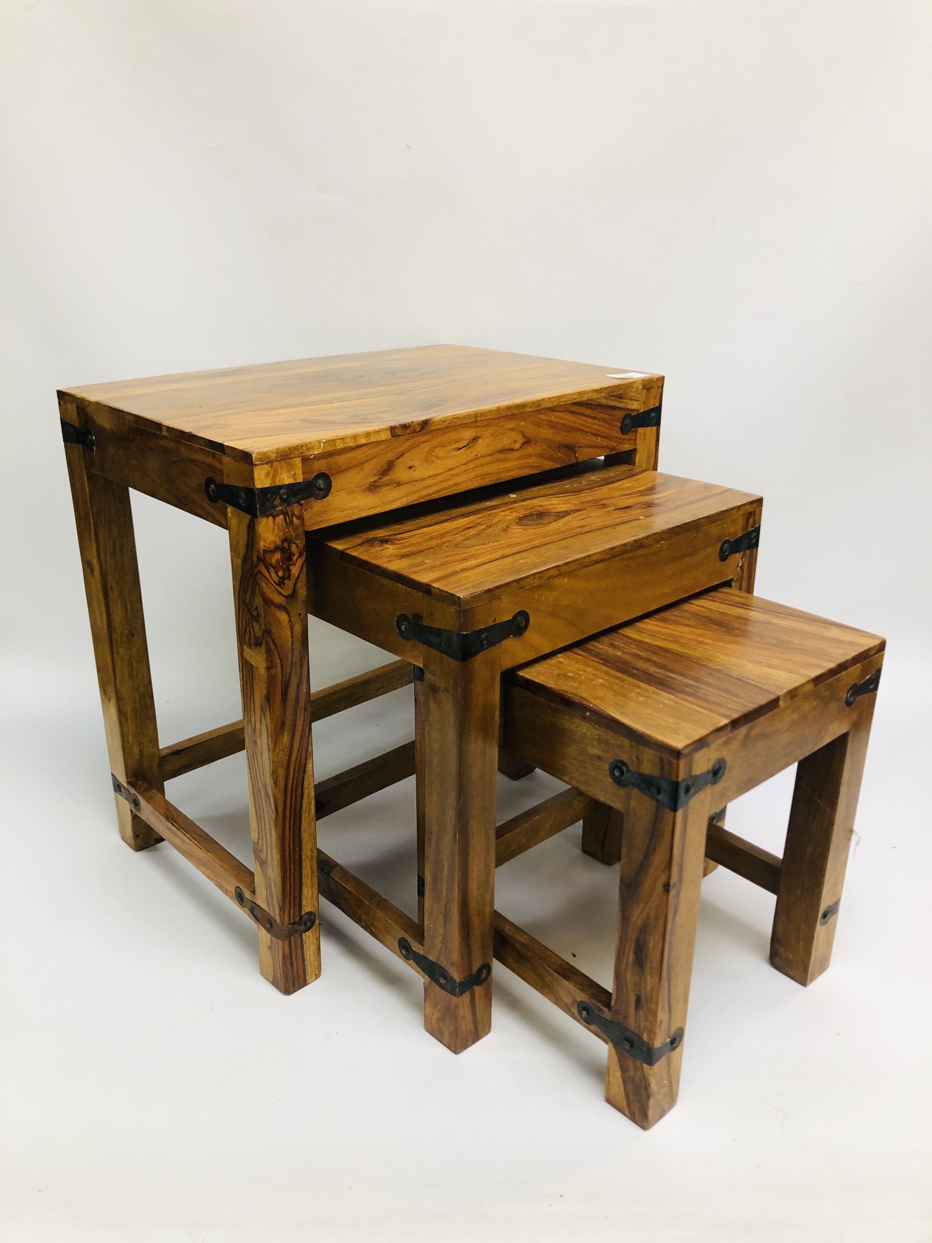 A NEST OF THREE MANGO WOOD GRADUATED TABLES. - Image 7 of 10