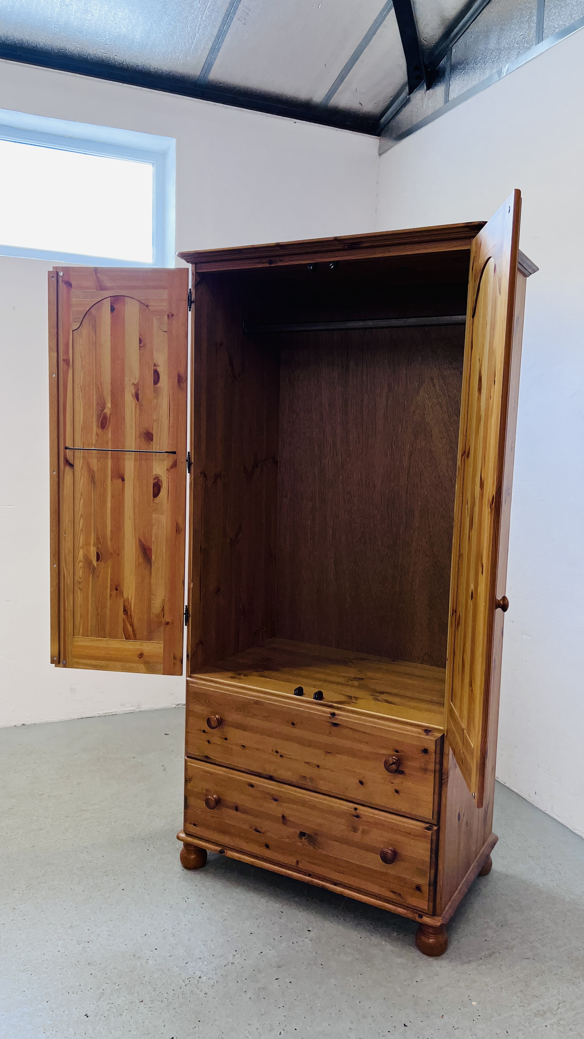 A GOOD QUALITY HONEY PINE TWO DOOR WARDROBE WITH TWO DRAWER BASE WIDTH 93CM. DEPTH 56CM. - Image 10 of 10