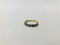 A 9CT. GOLD HALF ETERNITY RING SET WITH ALTERNATE DIAMONDS AND RUBIES.