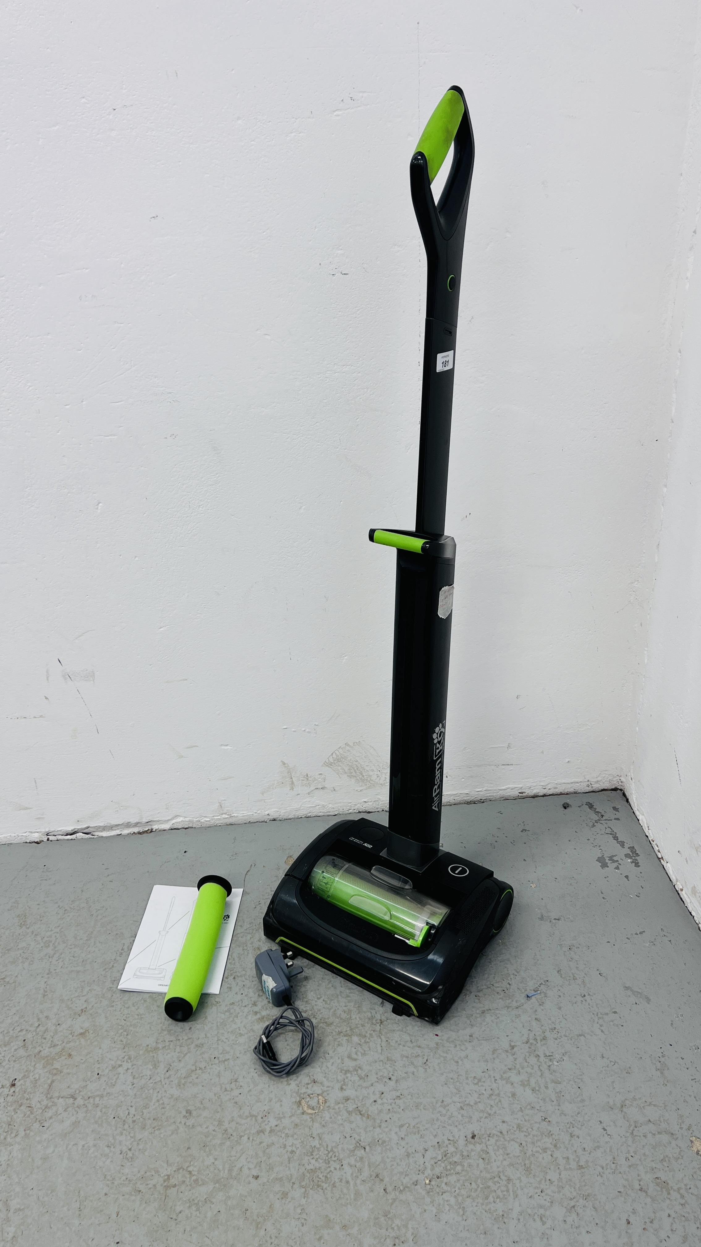 A GTECH AIR RAM K9 CORDLESS VACUUM CLEANER WITH CHARGER AND INSTRUCTIONS - SOLD AS SEEN.