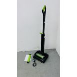 A GTECH AIR RAM K9 CORDLESS VACUUM CLEANER WITH CHARGER AND INSTRUCTIONS - SOLD AS SEEN.