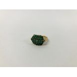 A 9CT. GOLD EMERALD CLUSTER RING.