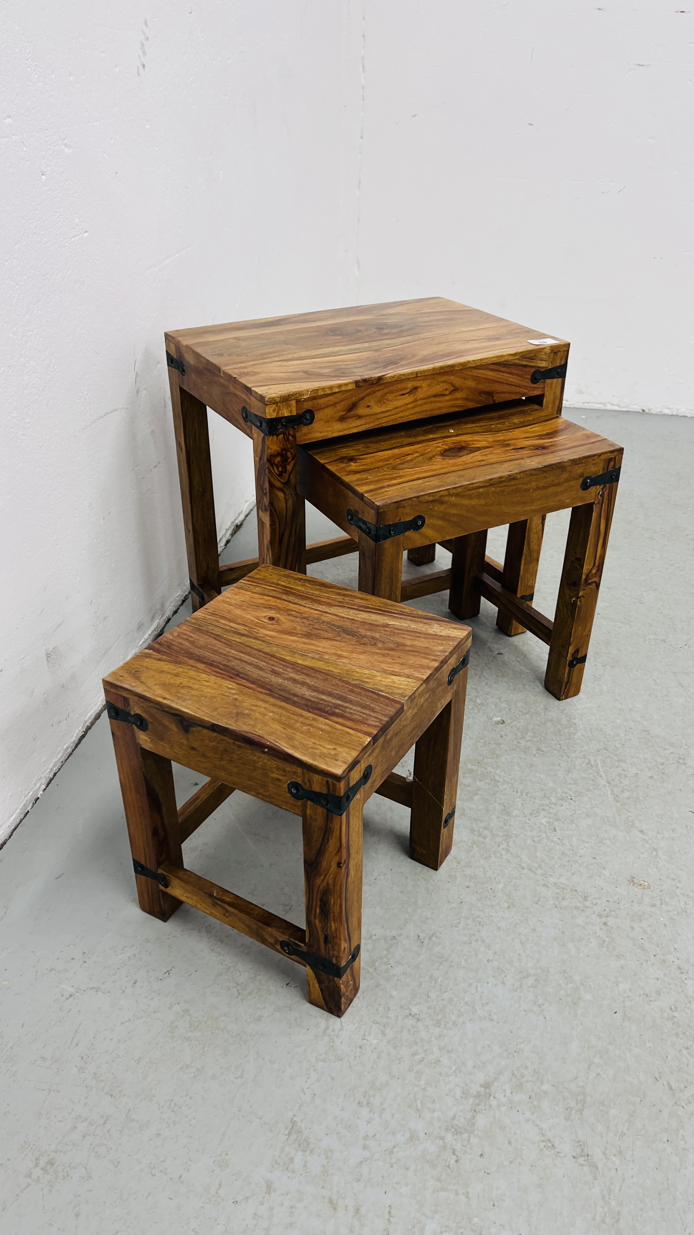 A NEST OF THREE MANGO WOOD GRADUATED TABLES. - Image 6 of 10