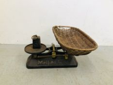 A VINTAGE MELLIN'S FOOD BABY WEIGHING SCALES L 50CM COMPLETE WITH WICKER BASKET 60CM X 33CM.