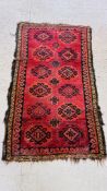 A BOKHARA RUG THE HOOKED LOZENGES ON A RED FIELD,