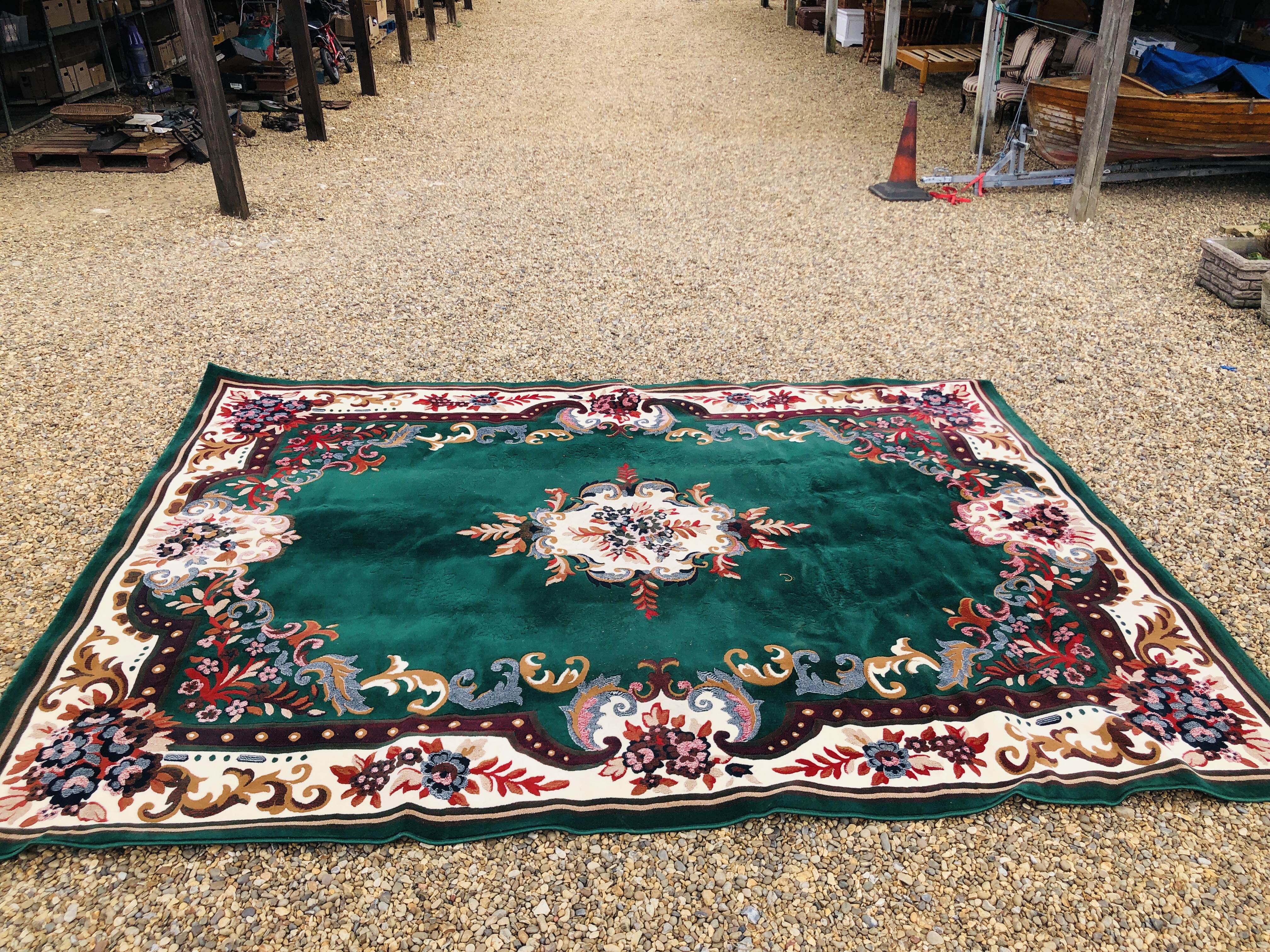 A MODERN CHINESE GARDEN CARPET SQUARE IN EMERALD GREEN 380/280.