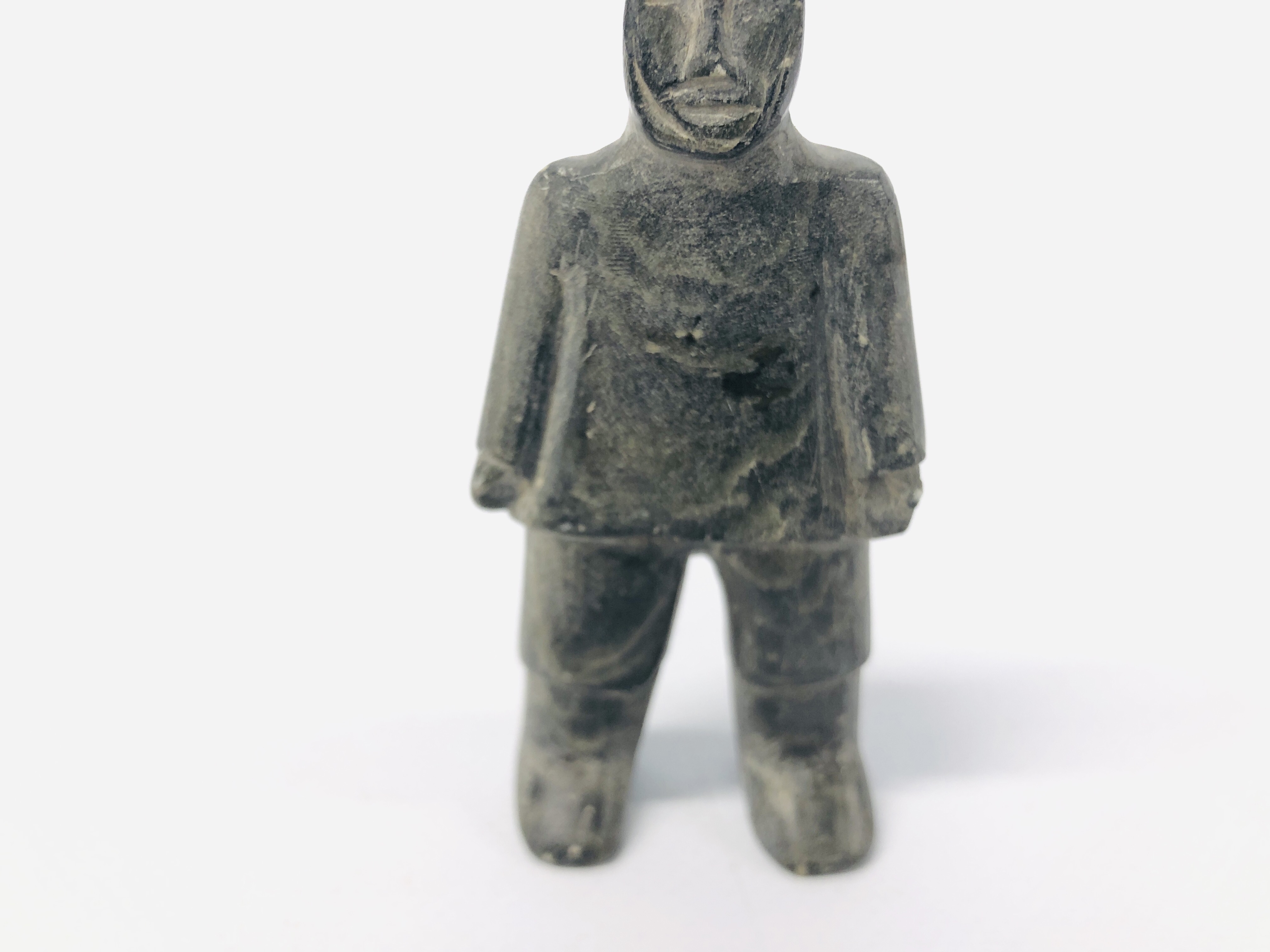 A CANADIAN CARVED SOAPSTONE OF AN INUIT FIGURE. - Image 3 of 6