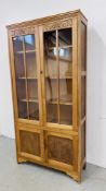 TWO OVER TWO DOOR PART GLAZED PINE DISPLAY CABINET WITH FLORAL CARVED DETAIL W 92CM, D 31CM,