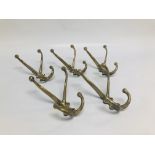 FIVE ANTIQUE BRASS COAT HOOKS SOME STAMPED "BR" ETC.