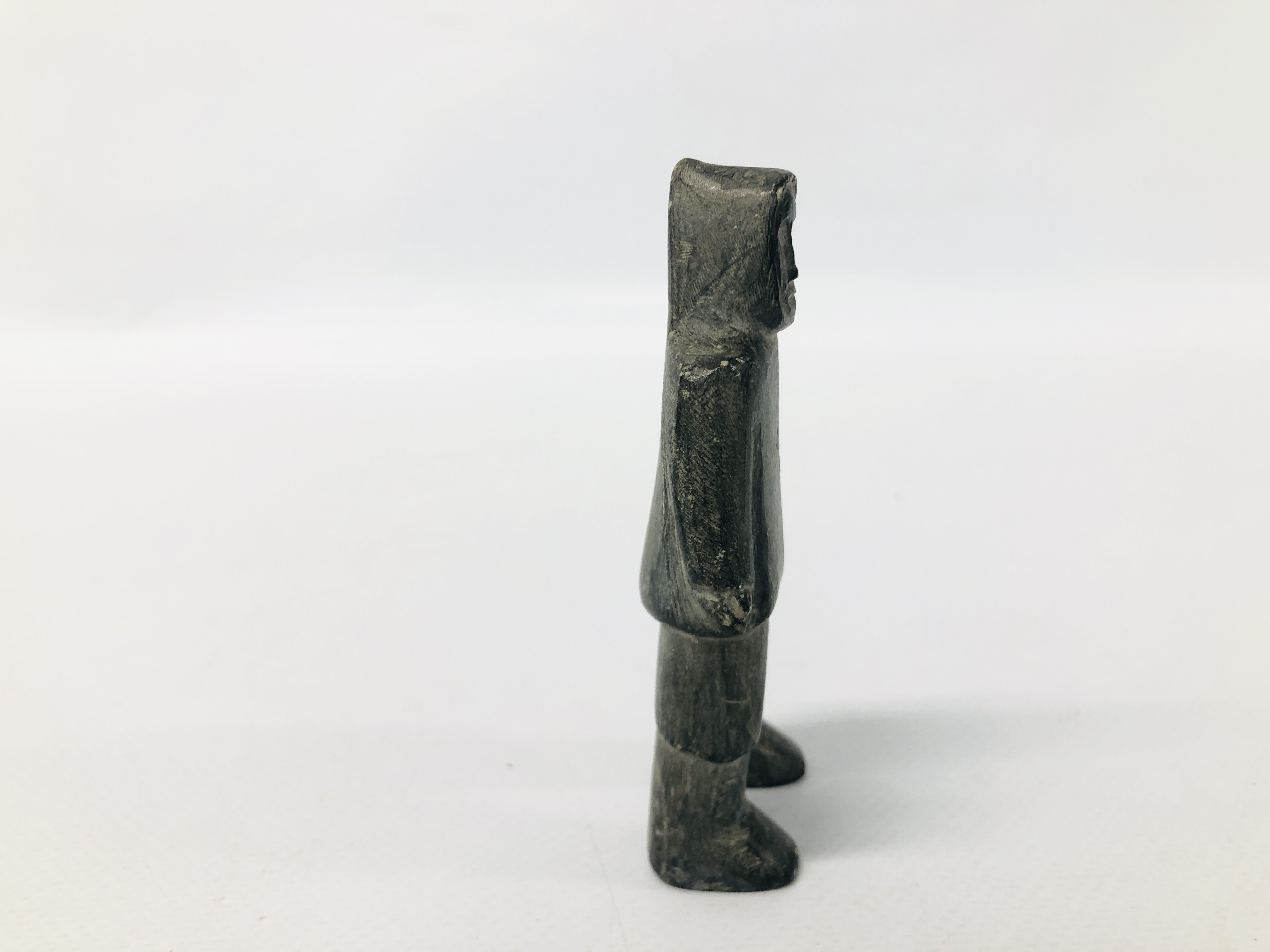 A CANADIAN CARVED SOAPSTONE OF AN INUIT FIGURE. - Image 5 of 6