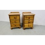 A PAIR OF GOOD QUALITY HONEY PINE THREE DRAWER BEDSIDE CABINETS WIDTH 46CM. DEPTH 40CM. HEIGHT 70CM.