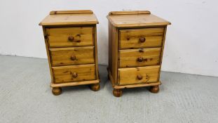 A PAIR OF GOOD QUALITY HONEY PINE THREE DRAWER BEDSIDE CABINETS WIDTH 46CM. DEPTH 40CM. HEIGHT 70CM.