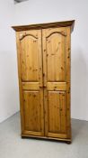 A GOOD QUALITY SOLID HONEY PINE DOUBLE WARDROBE W 96CM, D 56CM, H 188CM.