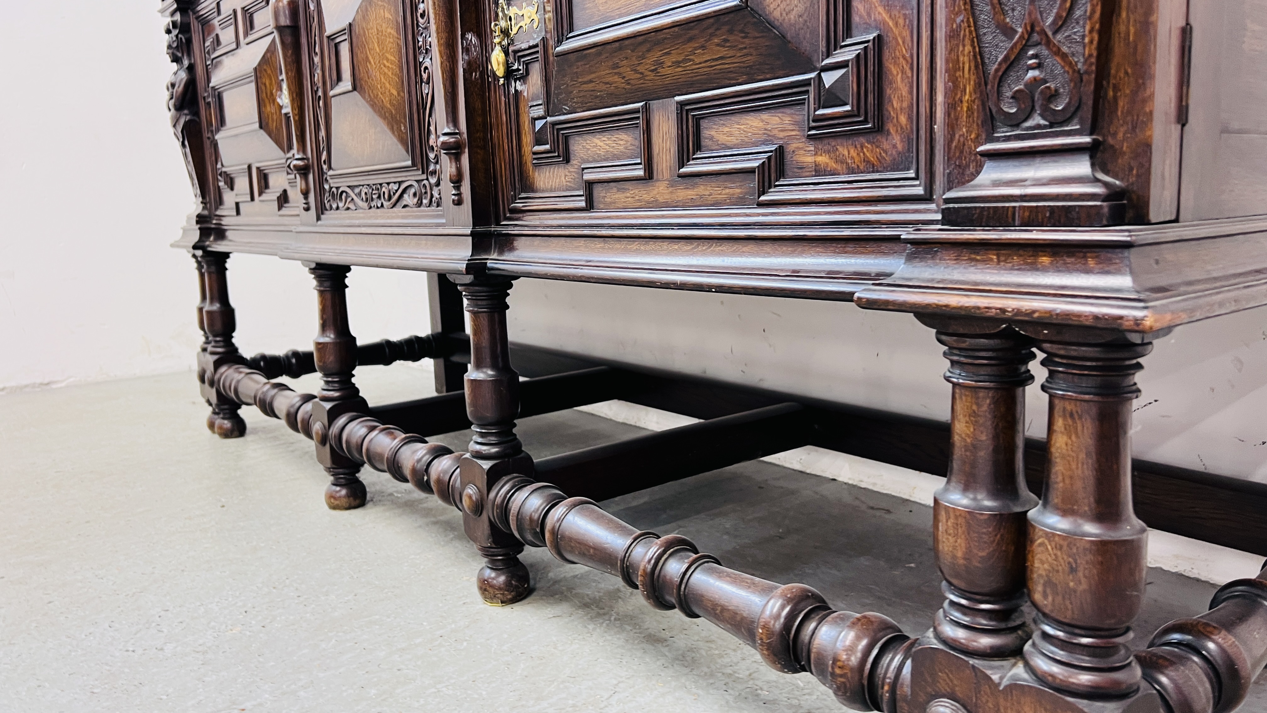 A C20TH CARVED OAK SIDEBOARD IN C17TH STYLE BY HAMPTONS OF LONDON W 198CM, D 66CM, H 101CM. - Bild 18 aus 18