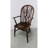 AN OAK AND ELM SEATED WHEEL BACK CHAIR
