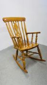 A GOOD QUALITY BEECHWOOD ROCKING CHAIR.