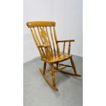 A GOOD QUALITY BEECHWOOD ROCKING CHAIR.