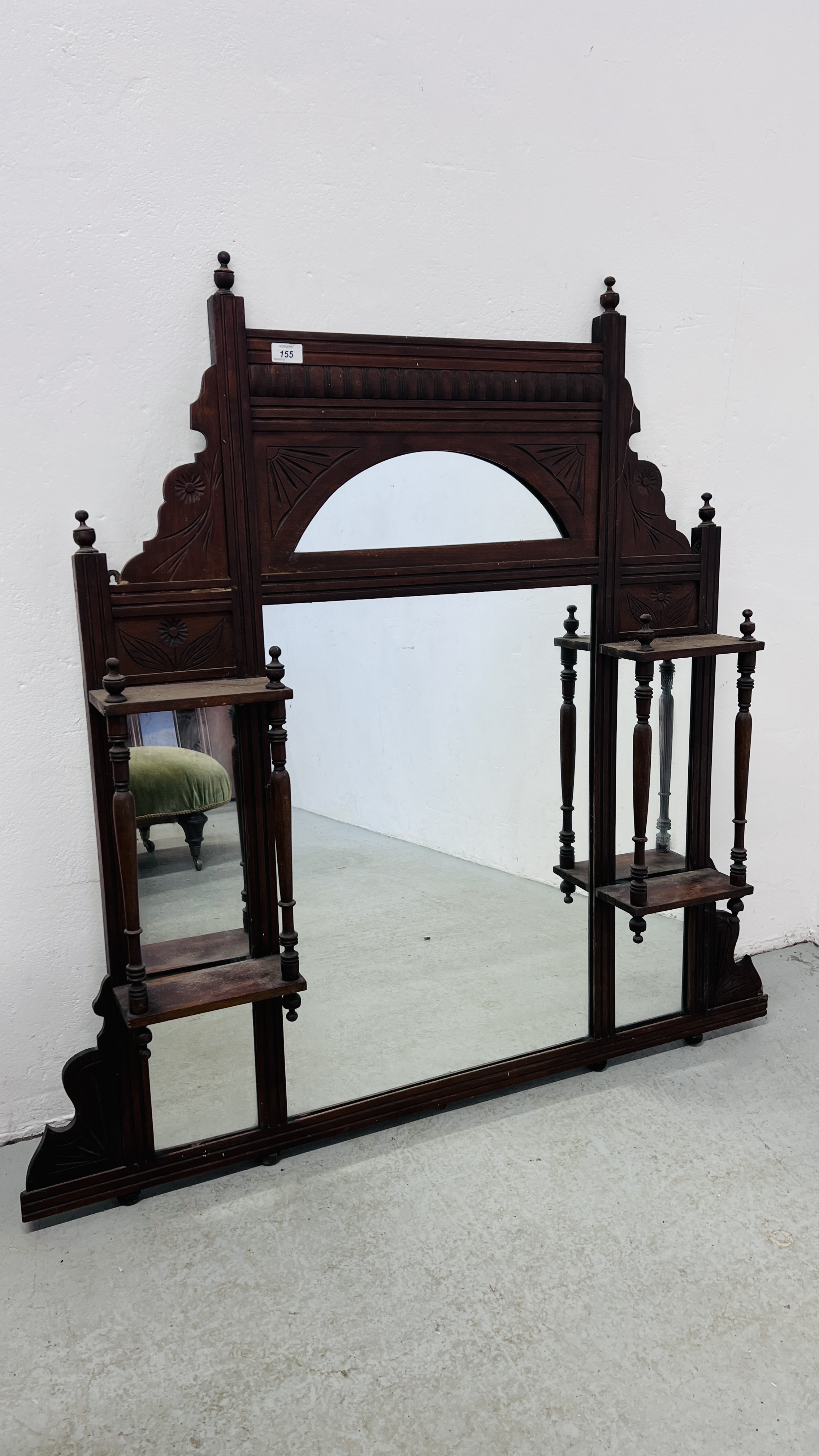 AN ORNATE MAHOGANY EDWARDIAN OVER MANTEL MIRROR.