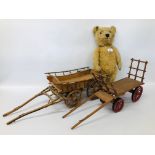 A VINTAGE CHILTERN HYGIENIC TOYS BEAR WITH GROWLER AND TWO HANDMADE MINATURE HORSE DRAWN CARTS.