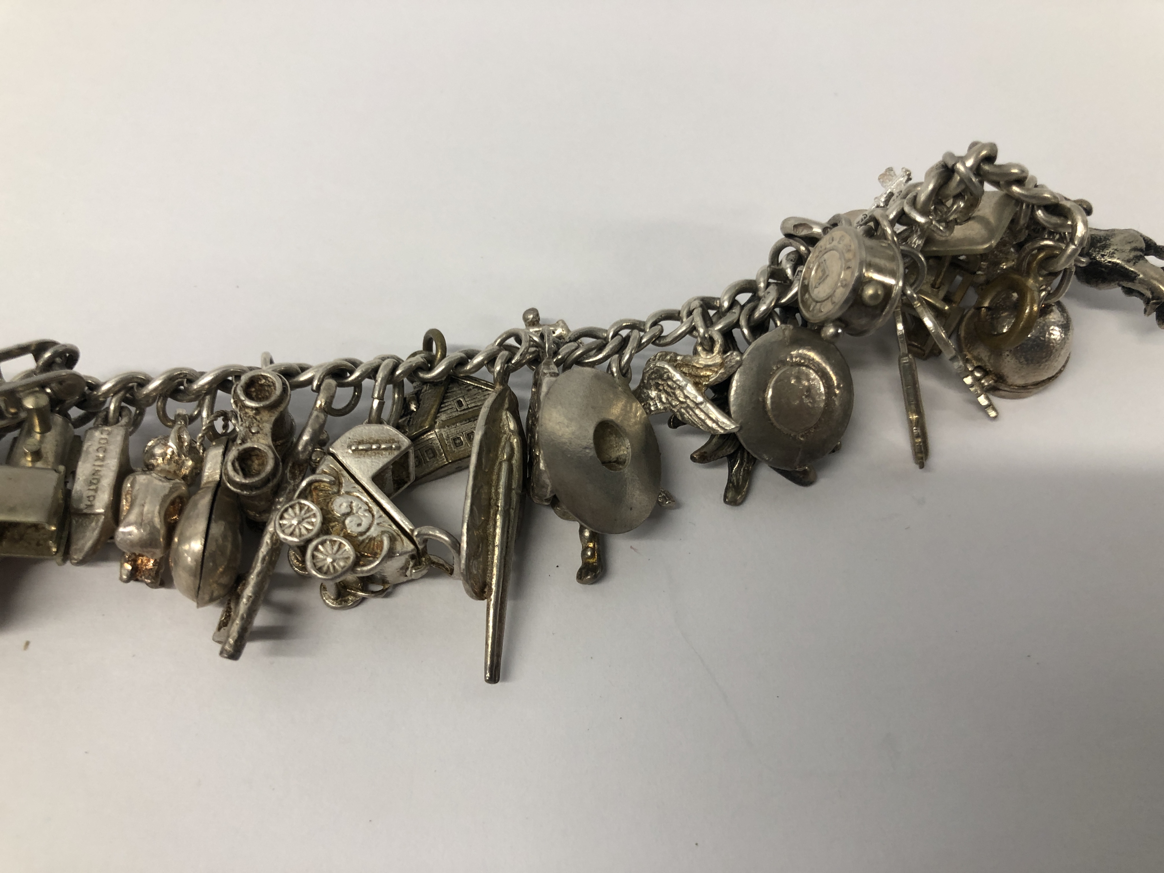 SILVER CHARM BRACELET TO INCLUDE APPROX 38 CHARMS MAINLY SILVER. - Image 4 of 6