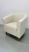 A MODERN CREAM FAUX LEATHER TUB CHAIR.