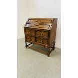 PERIOD HEAVY OAK JACOBEAN STYLE BUREAU OVER A TWO DOOR CUPBOARD BASE WIDTH 92CM. DEPTH 46CM.