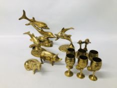 COLLECTION OF BRASS DOLPHINS, PIGS AND GOBLETS.