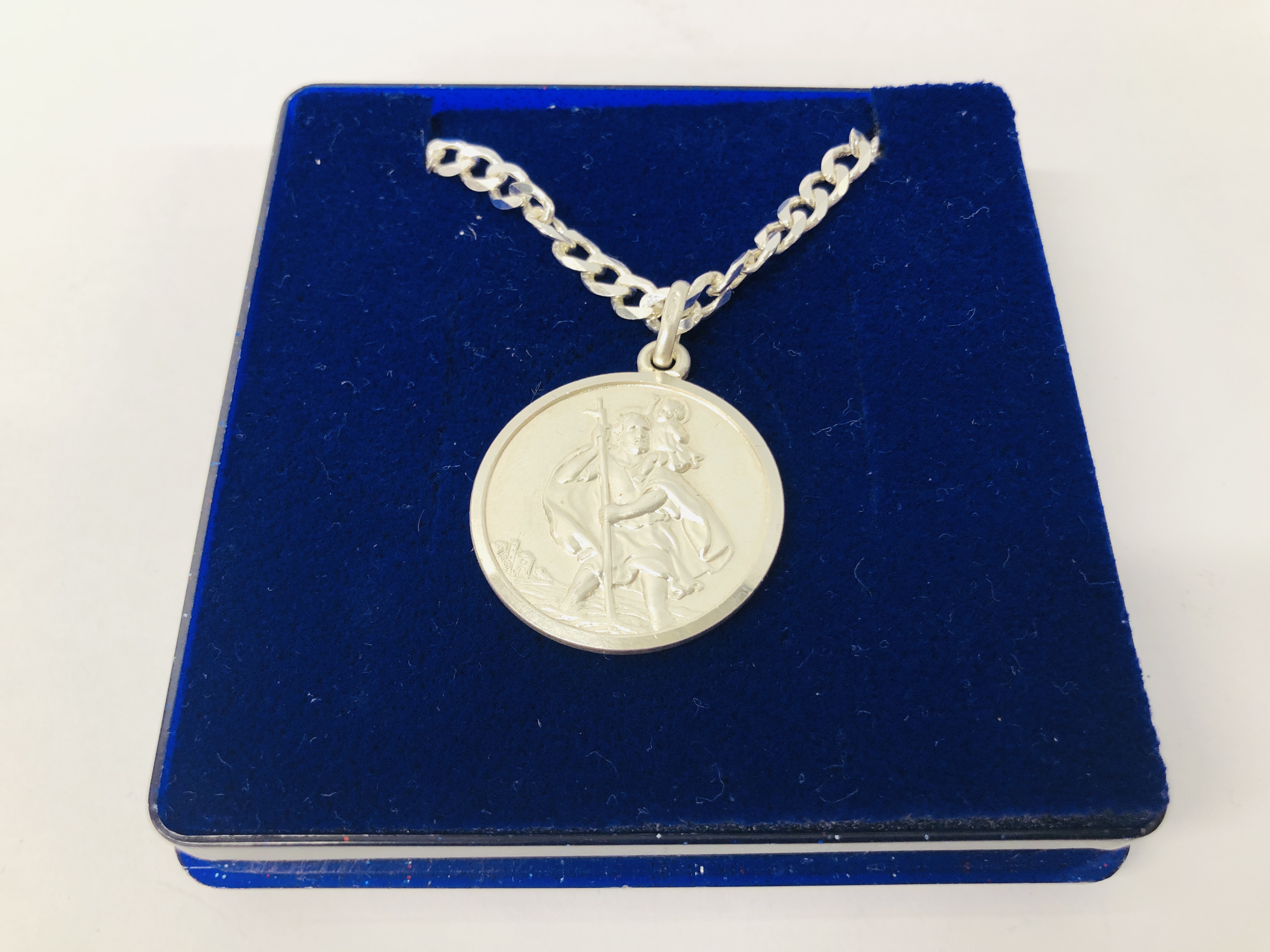 SILVER ST CHRISTOPHER PENDANT ON A SILVER FLAT LINK CURB CHAIN.