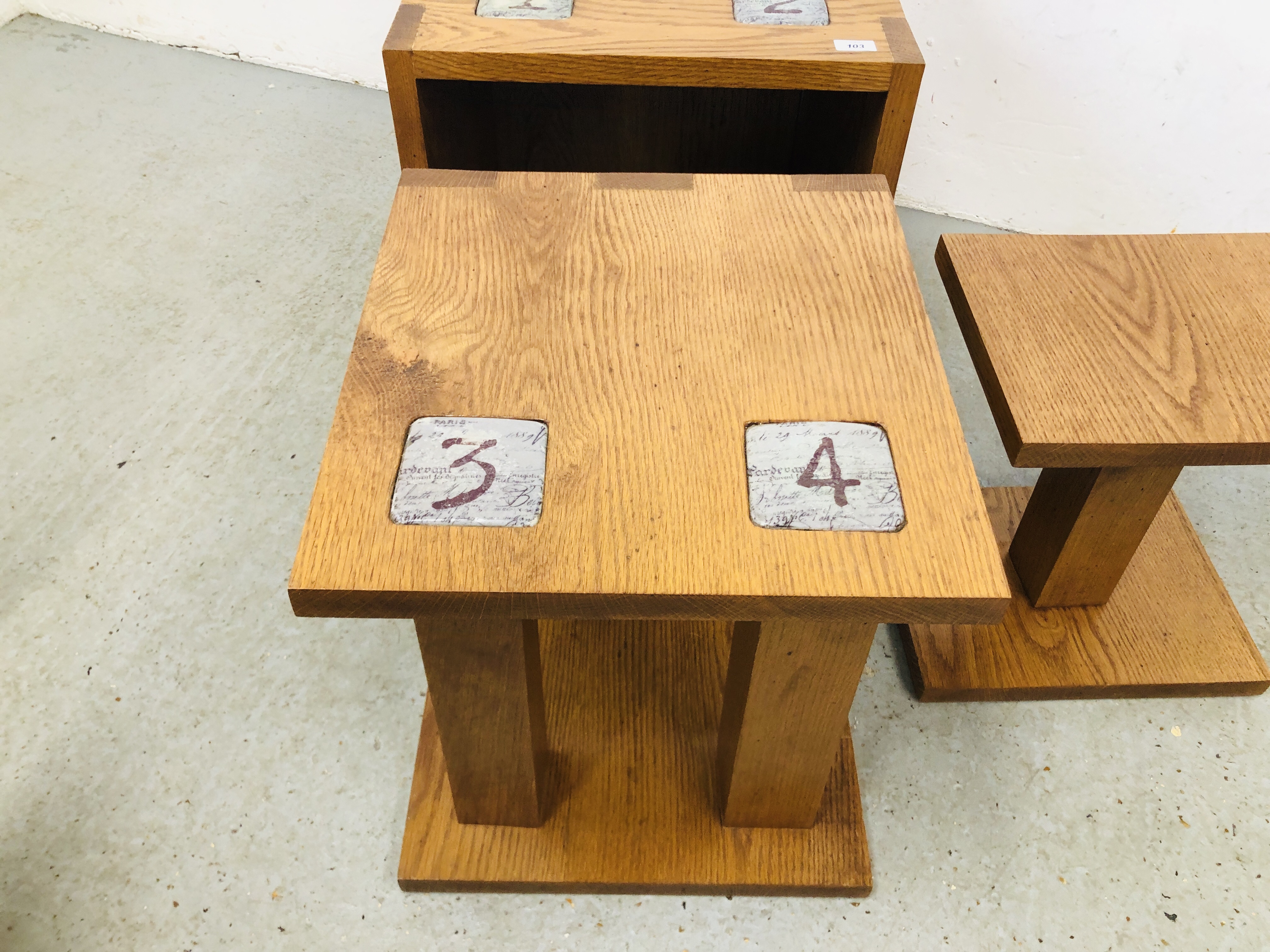 A SET OF THREE OAK GRADUATING TABLES COMPLETE WITH BUILT IN COASTERS, LARGEST 50CM X 50CM X 50CM. - Image 2 of 5