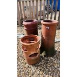 TWO TERRACOTTA CHIMNEY POTS ALONG WITH A TERRACOTTA PLANT POT
