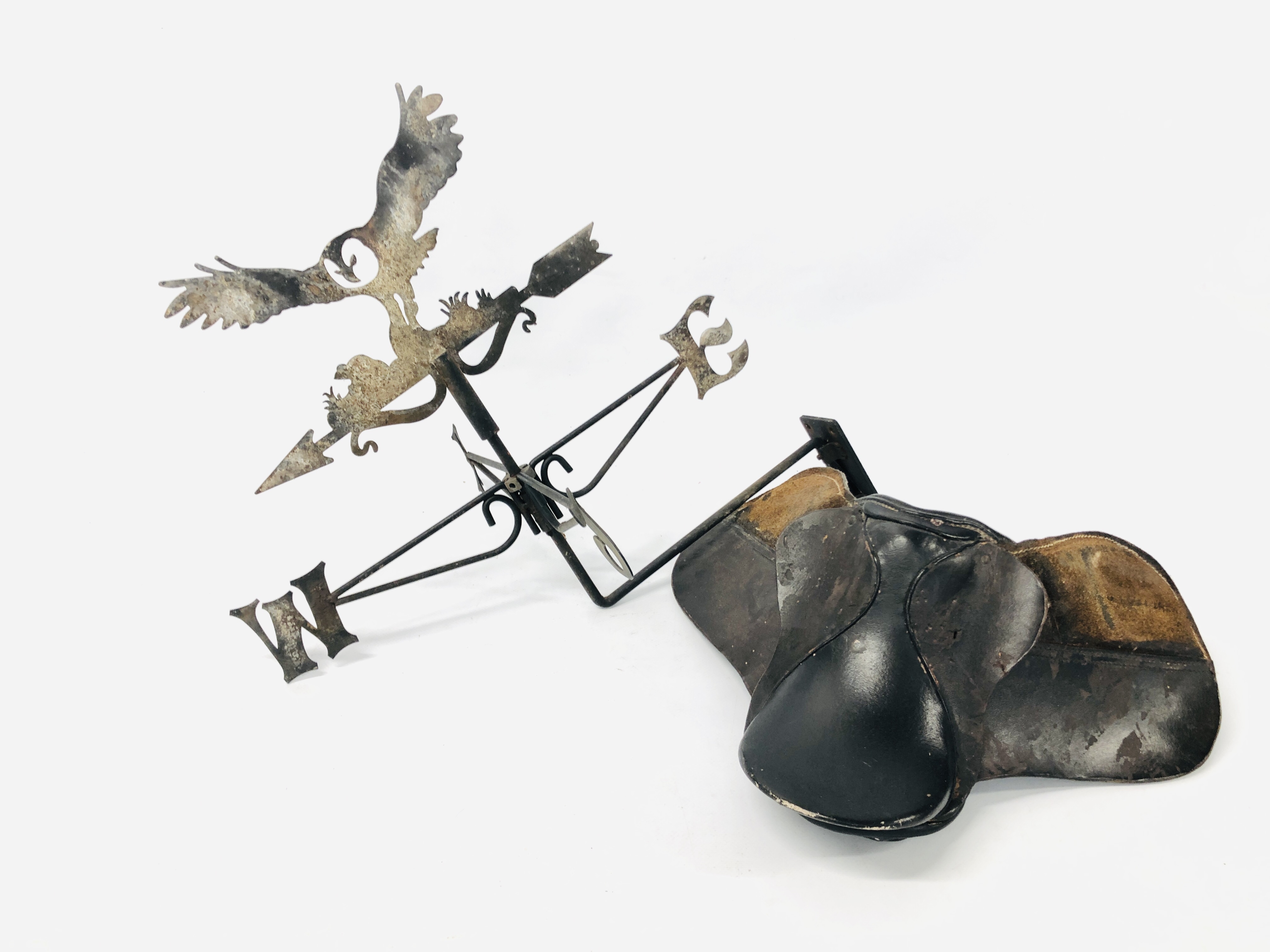 METAL CRAFT WEATHER VANE ALONG WITH A VINTAGE MINATURE LEATHER SADDLE.