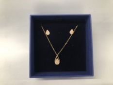 A BOXED GINGER PEAR DROP SWAROVSKI NECKLACE AND EARRING SET, NECKLACE LENGTH 38CM.