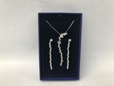 A BOXED SWAROVSKI DROP NECKLACE AND DROP EARRING SET.