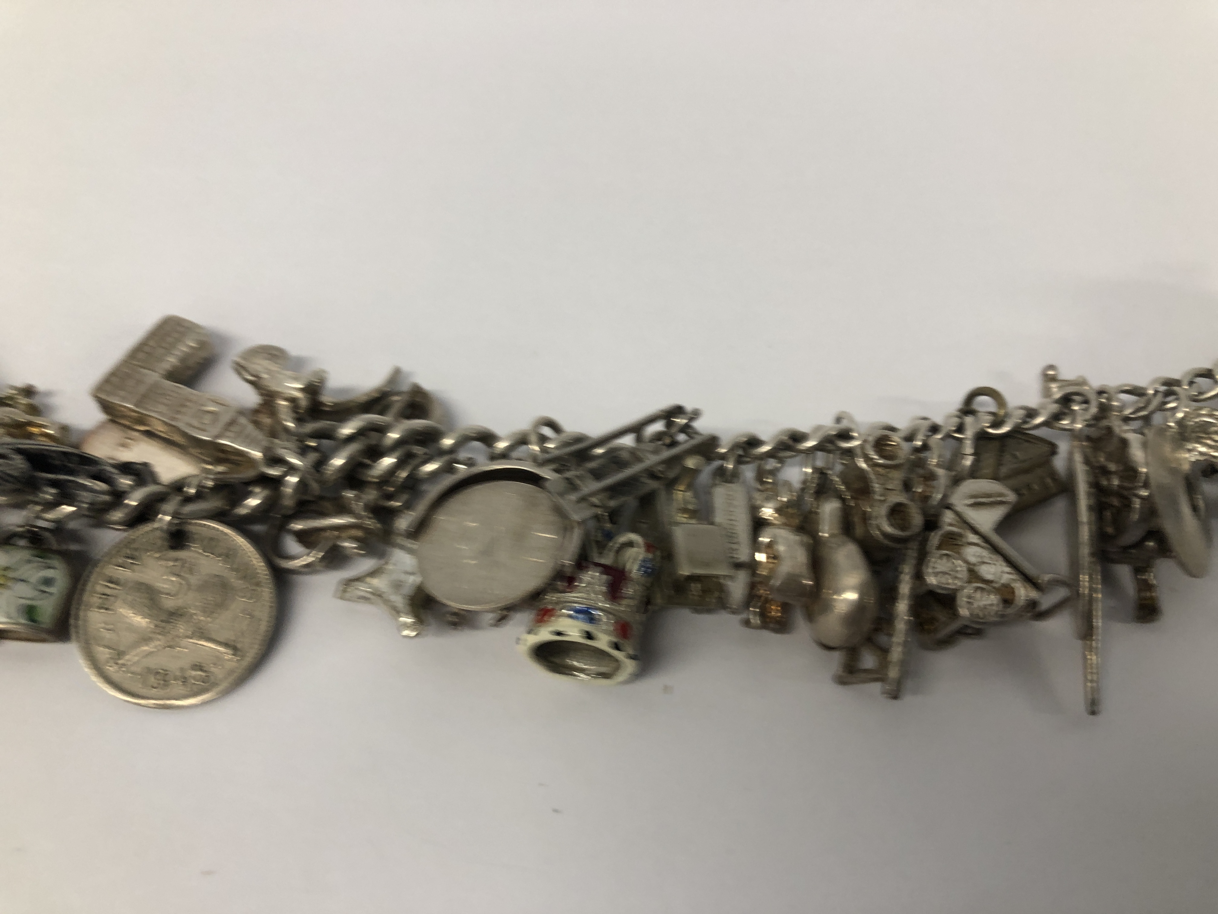 SILVER CHARM BRACELET TO INCLUDE APPROX 38 CHARMS MAINLY SILVER. - Image 2 of 6