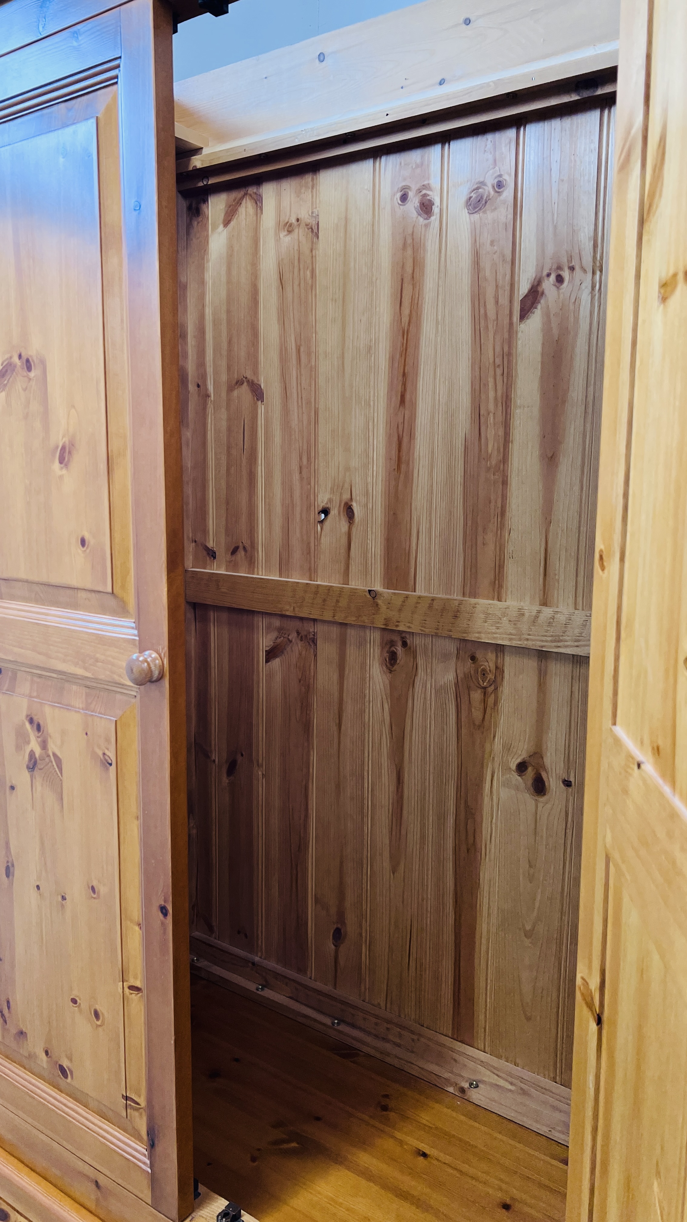 A GOOD QUALITY HONEY PINE FOUR DOOR WARDROBE WITH TWO DRAWER BASE WIDTH 228CM. DEPTH 59CM. - Image 13 of 14