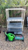 TWO GALVANISED METAL FOUR TIER WORKSHOP SHELVES, QUALCAST PANTHER 30 PUSH MOWER AND WATERING CAN.